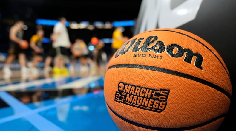 A March Madness basketball rests on the court as Iowa runs drills during practice at the NCAA college basketball tournament Thursday, March 19, 2026, in Tampa, Fla. (AP Photo/Chris O'Meara)