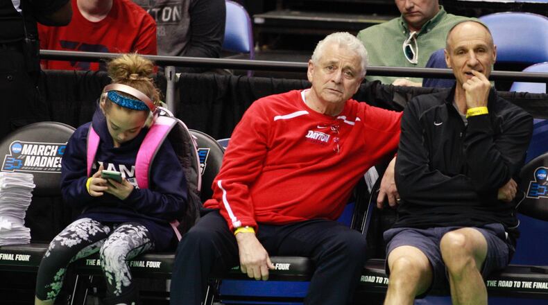 John Miller, center, father of Dayton coach Archie Miller, watches the Flyers practice Thursday. Archie’s daughter Leah is at left. David Jablonski/Staff