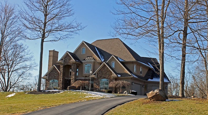 Built in 2008, the 5-bedroom home is surrounded by picturesque wooded views. It has about 5,470 sq. ft. of living space with a walkout lower level. CONTRIBUTED PHOTO BY VICKIE KAPNAS