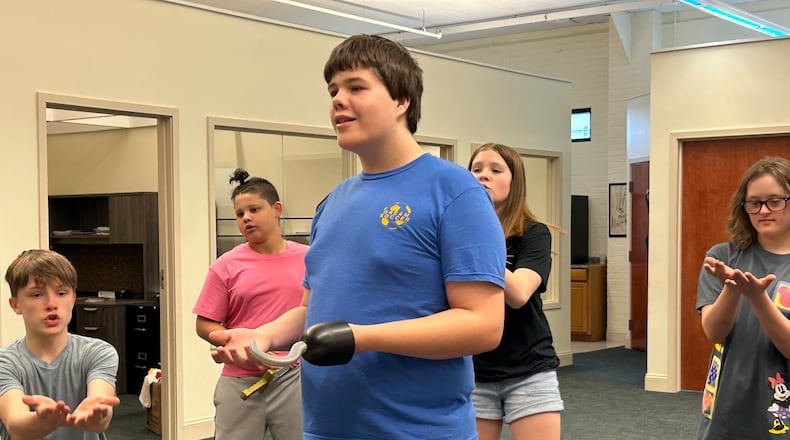 Karson Welch rehearses with members of the Youth Arts Ambassadors for the upcoming presentation of "Peter Pan Jr." at the John Legend Theater on Friday and Saturday. Several of the performers are part of the Springfield Arts Council's Penguin Project, which gives special needs youngsters the chance to learn theater skills and perform.