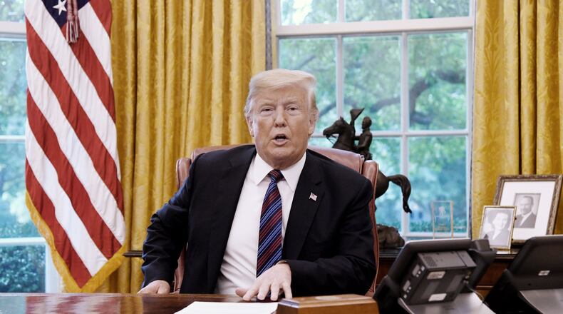U.S. President Donald Trump talks to Mexican President Enrique Pena Nieto during a phone conversation on Monday, Aug. 27, 2018 to announce the United States-Mexico Trade Agreement in the Oval Office of the White House in Washington, D.C. (Olivier Douliery/Abaca Press/TNS)