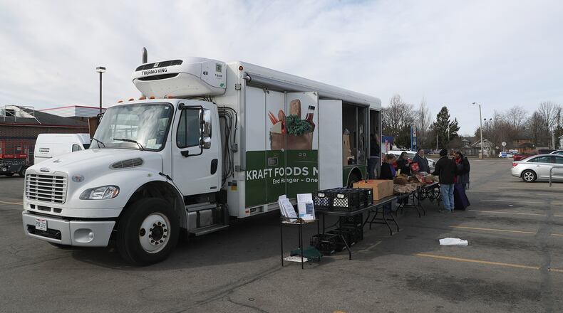 The Second Harvest Food Bank's Mobile Food Pantry in the parking lot of the former Kroger on South Limestone Street. BILL LACKEY/STAFF
