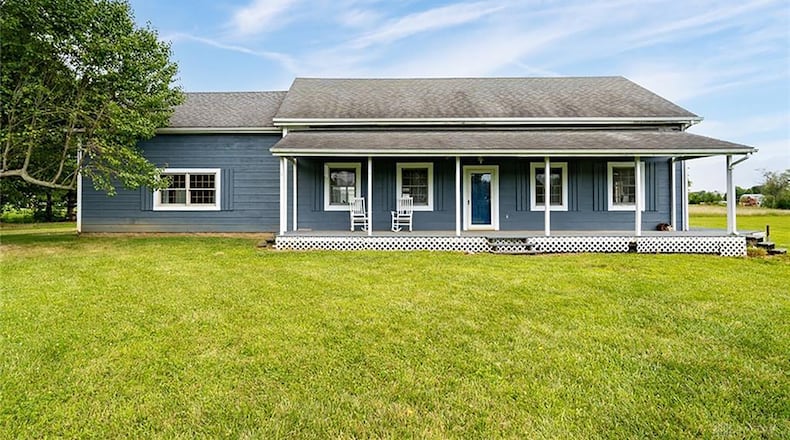 The 3-bedroom, Cape Cod-style home offers about 2,250 sq. ft. of living space. The 7.49-acre property also includes a detached, 4-car garage, a pond and a pole barn. CONTRIBUTED PHOTO