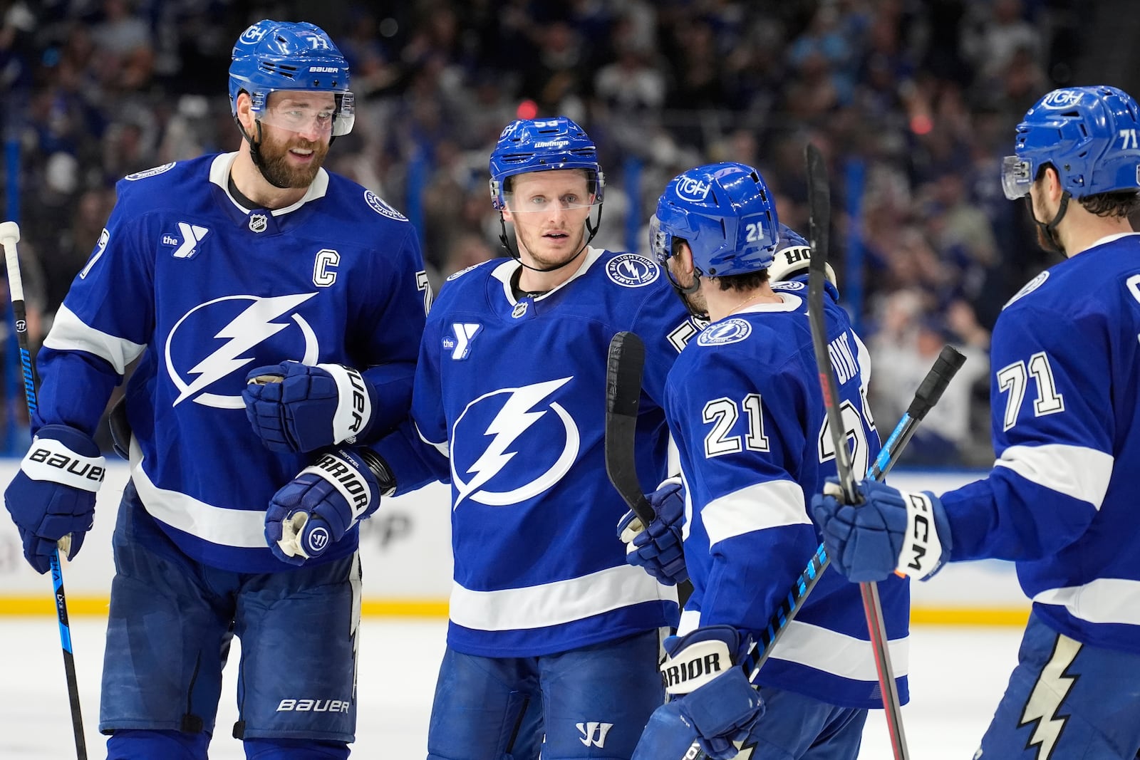 Tampa Bay Lightning center Jake Guentzel (59) celebrates his goal against the Florida Panthers with defenseman Victor Hedman (77), center Brayden Point (21) and center Anthony Cirelli (71) during the second period in Game 5 of an NHL hockey Stanley Cup first-round playoff series, Wednesday, April 30, 2025, in Tampa, Fla. (AP Photo/Chris O'Meara)
