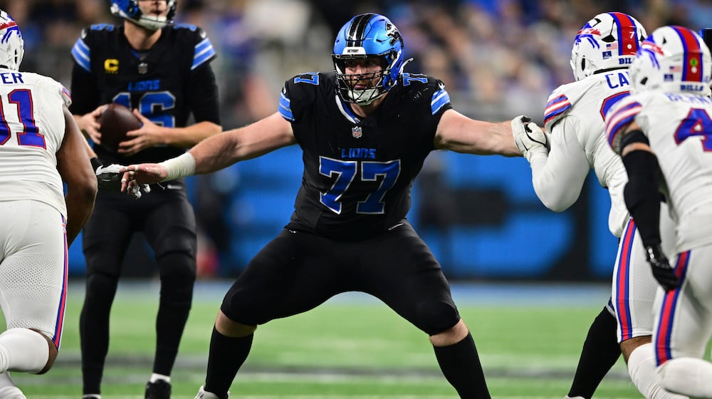 FILE - Detroit Lions center Frank Ragnow looks to block during the second half of an NFL football game against the Buffalo Bills in Detroit, Dec. 15, 2024. (AP Photo/David Dermer, File)