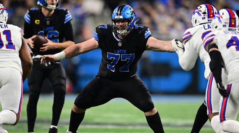 FILE - Detroit Lions center Frank Ragnow looks to block during the second half of an NFL football game against the Buffalo Bills in Detroit, Dec. 15, 2024. (AP Photo/David Dermer, File)