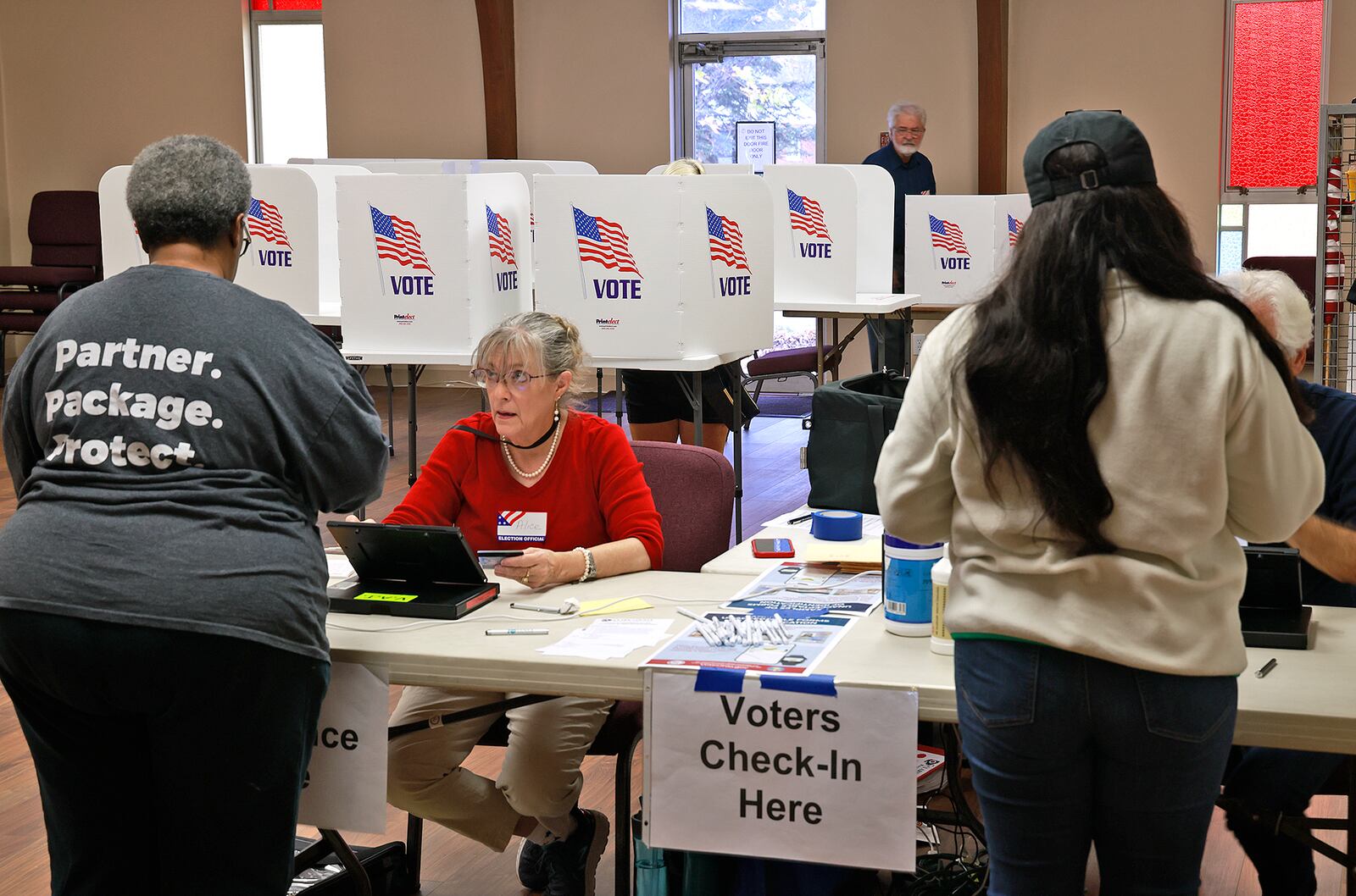 Voters check-in Tuesday, Nov. 5, 2025 at the election poll in the Covenant United Methodist Church in Springfield.  BILL LACKEY/STAFF