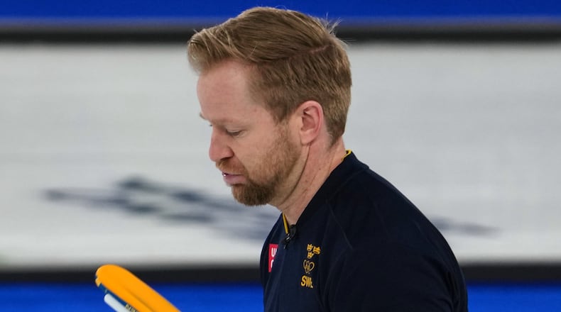 Sweden's Niklas Edin reacts after the men's curling round robin session against Germany, at the 2026 Winter Olympics, in Cortina d'Ampezzo, Italy, Monday, Feb. 16, 2026. (AP Photo/Misper Apawu)