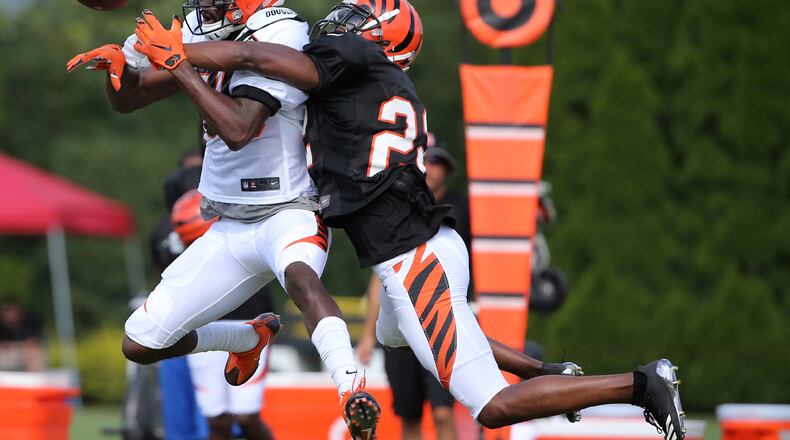 Cincinnati Bengals cornerback William Jackson (22) breaks up a pass intended for Cincinnati Bengals wide receiver Josh Malone (80) during an NFL training camp, Tuesday, Aug. 8, 2017, in Cincinnati. (Kareem Elgazzar/Associated Press)
