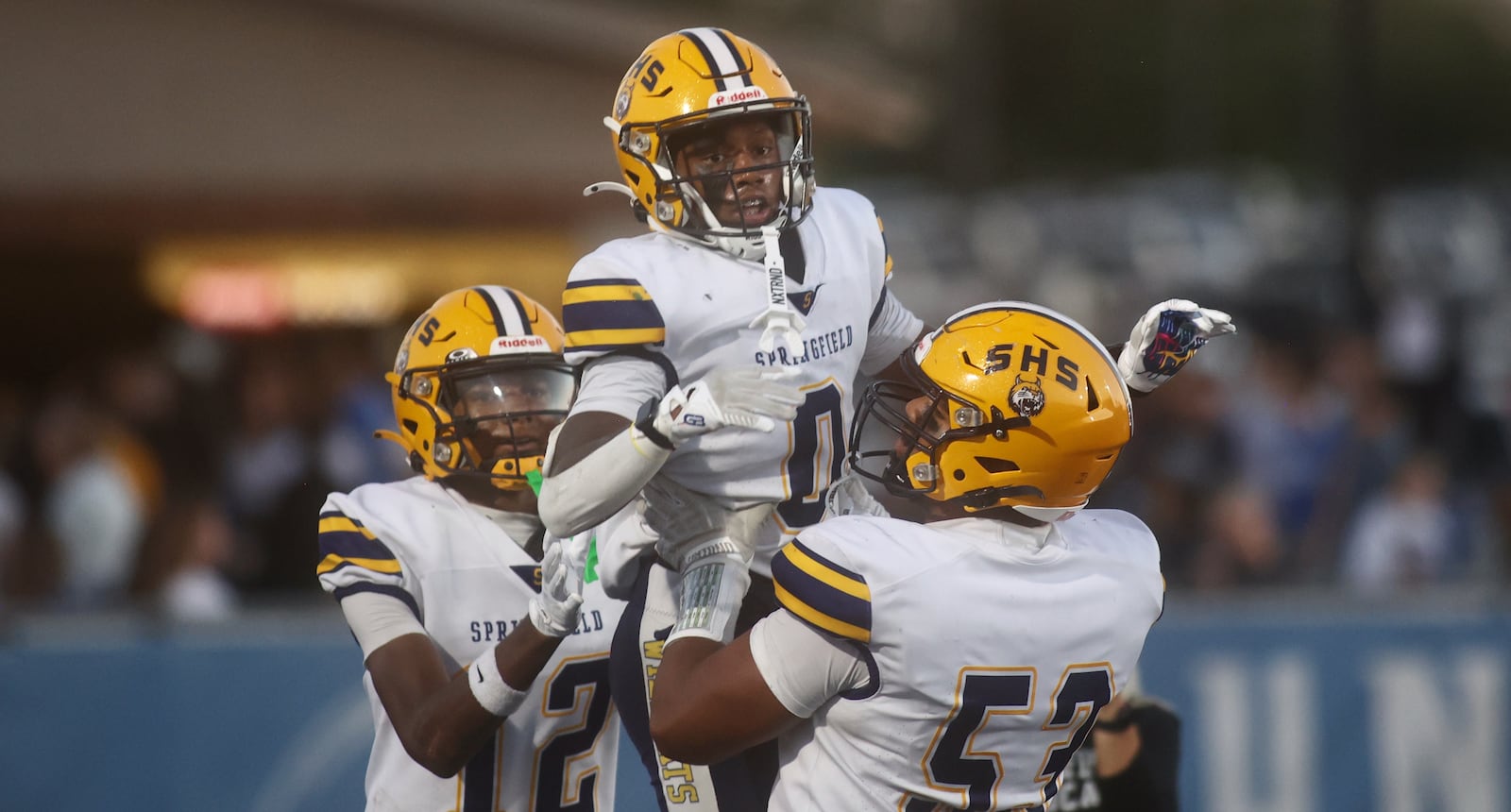 Springfield celebrates after a touchdown run by Deontre Long, center, against Springboro on Friday, Sept. 26, 2025, at CareFlight Field in Springboro. David Jablonski/Staff