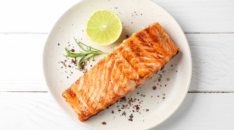 Salmon is a good fatty fish source for women with menopause symptoms. ISTOCK
