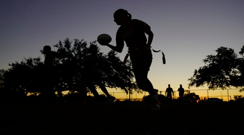 FILE - Players run drills during a practice with Texas Fury, an all-girls flag football select travel team, Dec. 10, 2023, in Austin, Texas. (AP Photo/Eric Gay, File)
