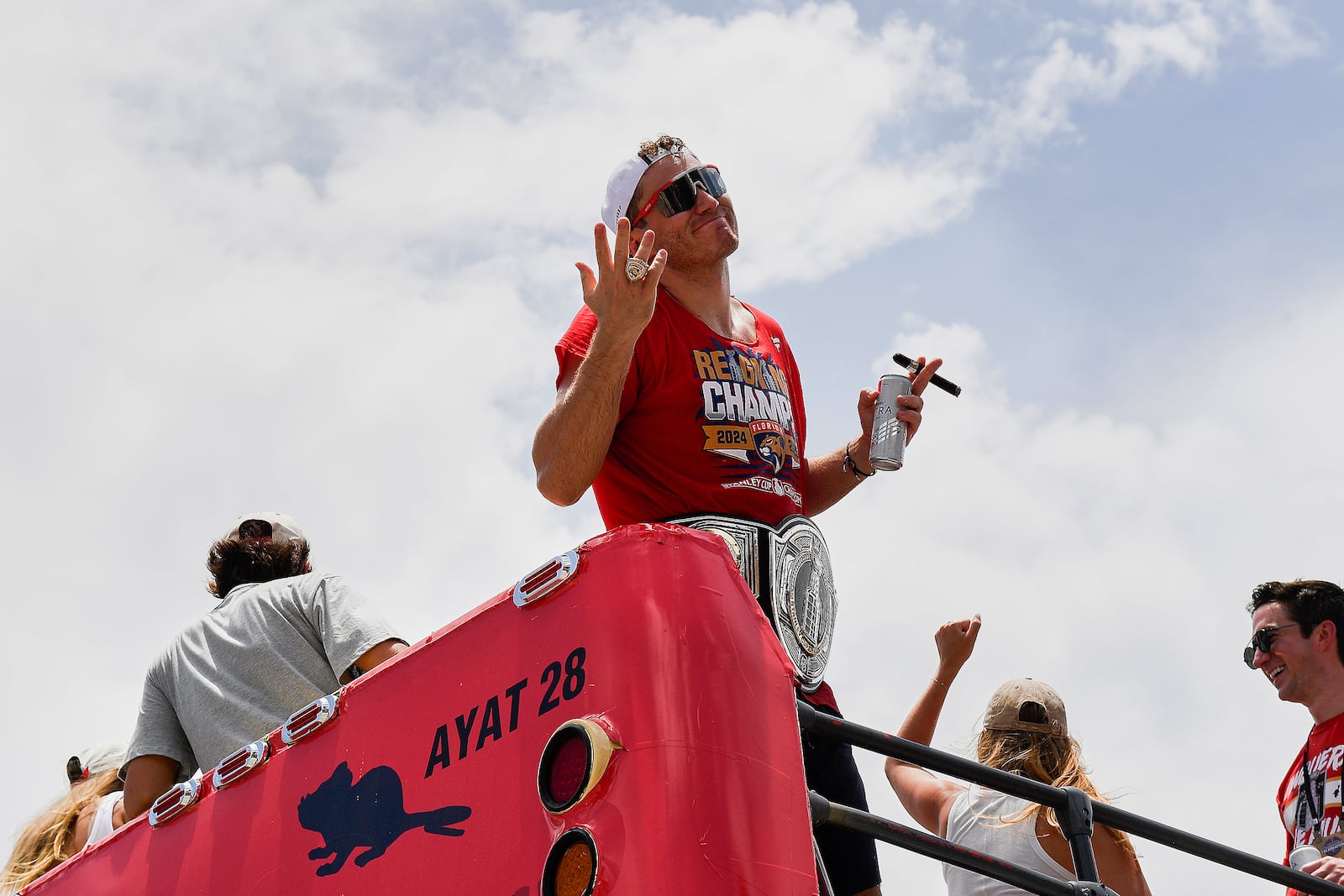 Florida Panthers' Matthew Tkachuk shows his championship ring during the NHL hockey team's Stanley Cup championship celebration, Sunday, June 20, 2022, in Fort Lauderdale, Fla. (AP Photo/Michael Laughlin)