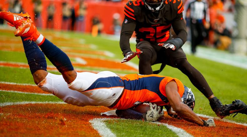 DENVER, CO - NOVEMBER 3: Wide receiver Courtland Sutton #14 of the Denver Broncos catches a touchdown pass as safety Jermaine Whitehead #35 of the Cleveland Browns defends on the play during the first quarter at Broncos Stadium at Mile High on November 3, 2019 in Denver, Colorado. (Photo by Justin Edmonds/Getty Images)