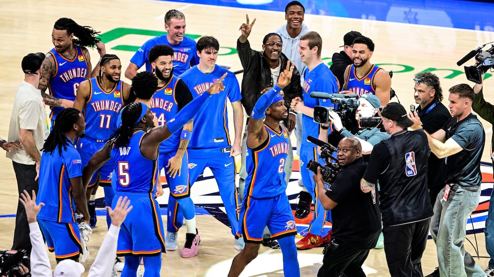 Oklahoma City Thunder guard Shai Gilgeous-Alexander (2) celebrates with teammates after the second half of an NBA basketbal against the Denver Nuggetsl game Monday, March 9, 2026, in Oklahoma City. (AP Photo/Gerald Leong)