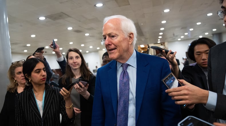 Sen. John Cornyn, R-Texas, departs following votes at the Capitol, Thursday, March 5, 2026, in Washington. (AP Photo/Allison Robbert)