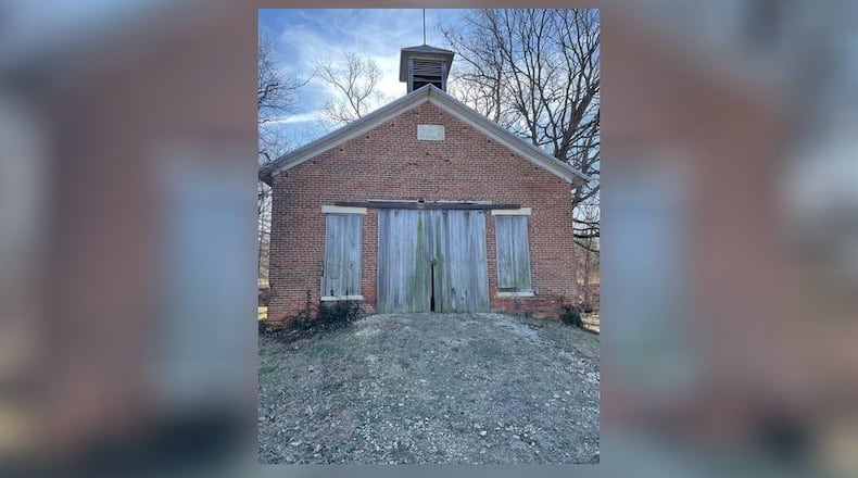 The school bell can still be seen in the wooden bell tower above the door of Central School.