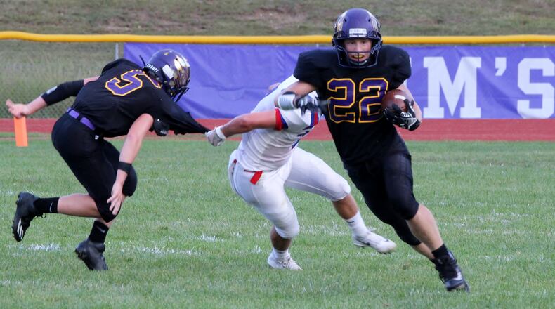 Mechanicsburg High School running back Joey Mascadri runs the ball against Greeneview on Friday night. The Rams won the game 17-14. MICHAEL COOPER/STAFF