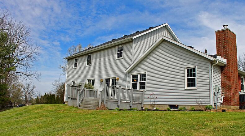 A large rear deck overlooks the backyard.