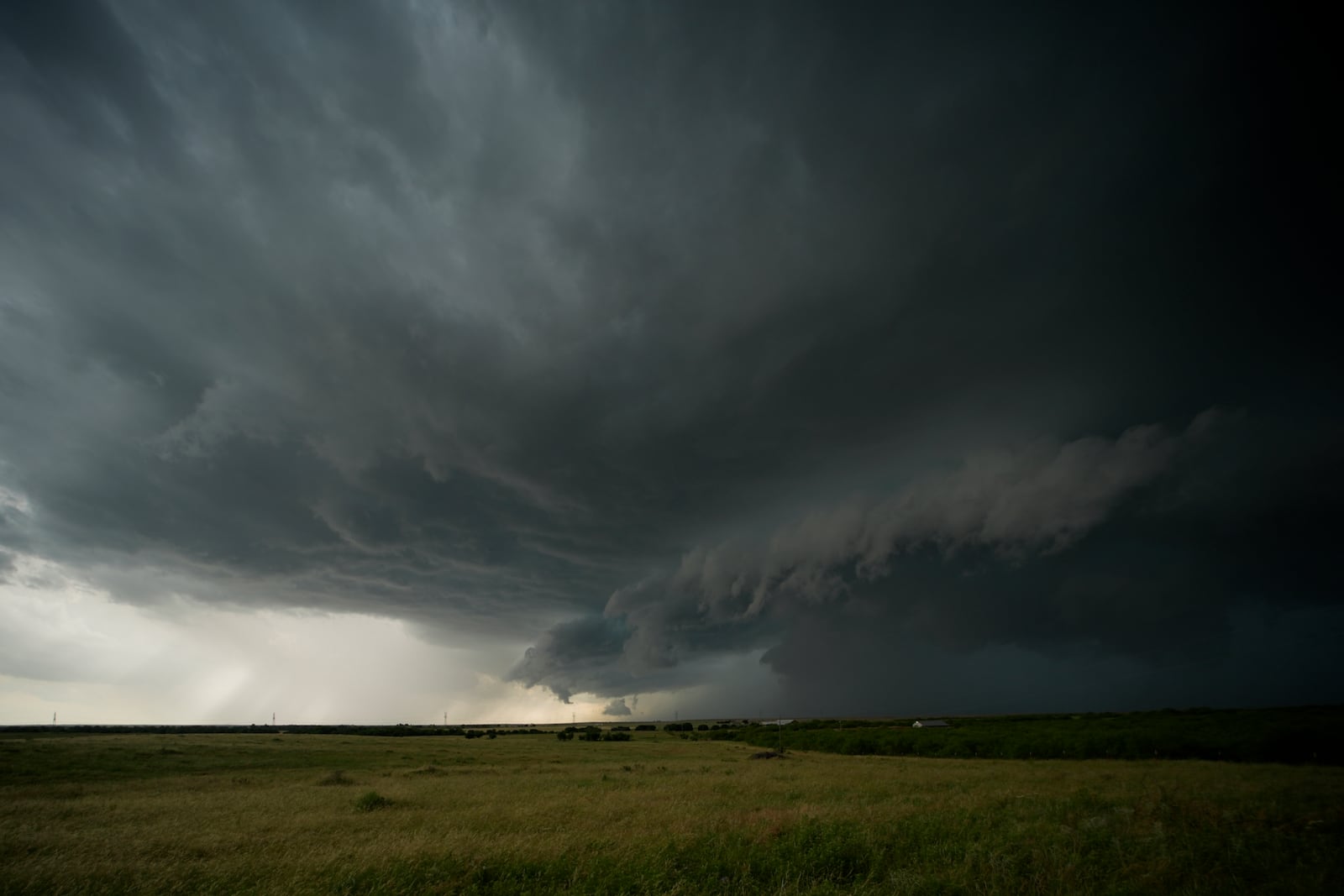 An approaching storm with a shelf cloud and rain shaft is visible during a Project ICECHIP operation on Tuesday, June 3, 2025, in Scotland, Texas. (AP Photo/Carolyn Kaster)