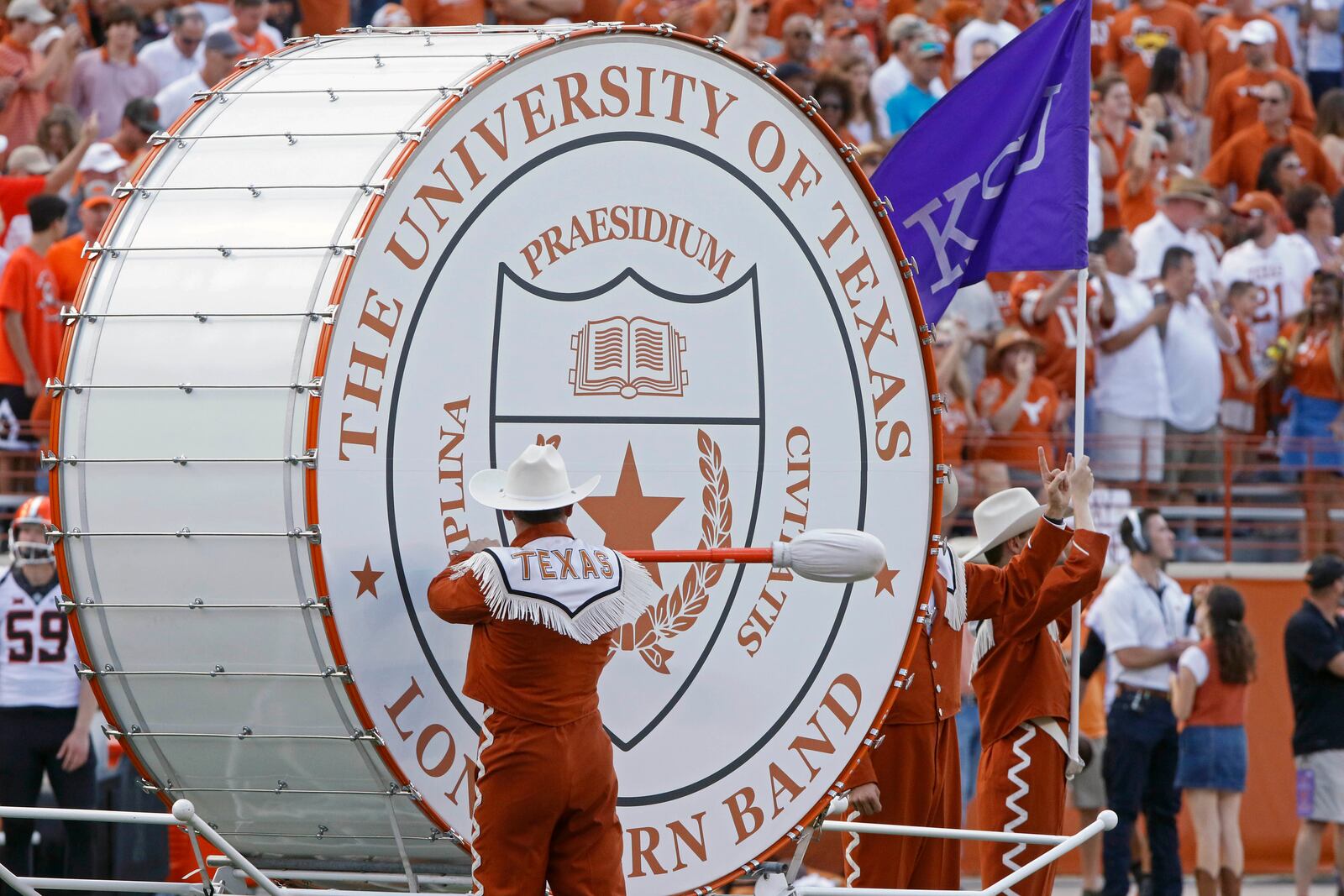 FILE - Texas' "Big Bertha" bass drum is played before the start of an NCAA college football game against Oklahoma State, Saturday, Oct. 21, 2017, in Austin, Texas. (AP Photo/Michael Thomas, File)