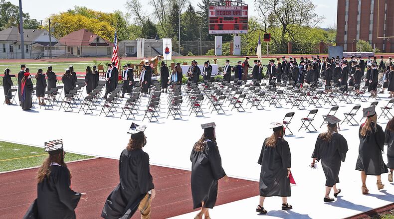 Wittenberg University and Clark State College will host their graduation ceremonies this weekend. Here, Wittenberg held their 171 Commencement Ceremony last year at the school's Edwards-Maurer Stadium instead of the traditional Commencement Hollow. BILL LACKEY/STAFF