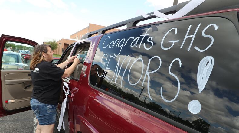 Graduating seniors at Graham High School participated in a graduation parade through St. Paris in May. The seniors were led by a Champaign County Sheriff's cruiser as they traveled from St. Paris to Christiansburg and around to all the small towns in the school district. BILL LACKEY/STAFF