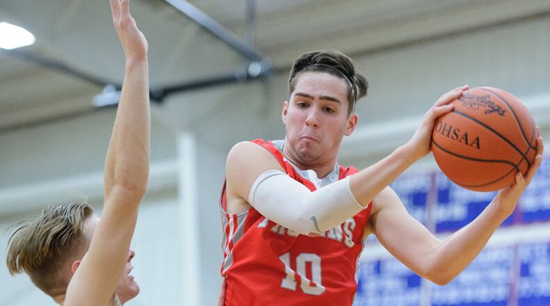 Southeastern senior forward Andrew Lyons grabs a rebound during an Ohio Heritage Conference win over Greeneview on Friday night. BRYANT BILLING / CONTRIBUTED