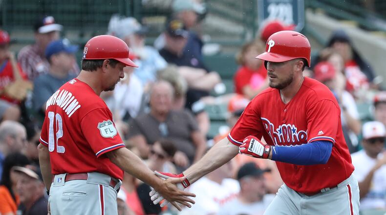 SARASOTA, FL - MARCH 13: Brock Stassi #78 of the Philadelphia Phillies celebrates with the third base coach Mickey Morandini #12 after hitting a solo home run in the third inning of the Spring Training game against the Baltimore Orioles on March 13, 2017 at Ed Smith Stadium in Sarasota, Florida. (Photo by Leon Halip/Getty Images)