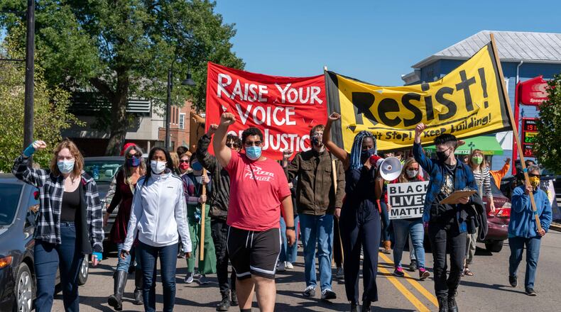 At a weekly Black Lives Matter protest in Yellow Springs on Saturday, Sept. 19, demonstrators marched downtown, blocking traffic. Marchers shouted the names of Black people killed by police officers and chanted things like, "when Black lives are under attack, what do we do? Stand up, fight back."