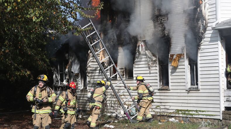 The Springfield Fire Division battled a residential fire at 822 Kenton St. Friday afternoon, Oct. 8, 2021. BILL LACKEY/STAFF