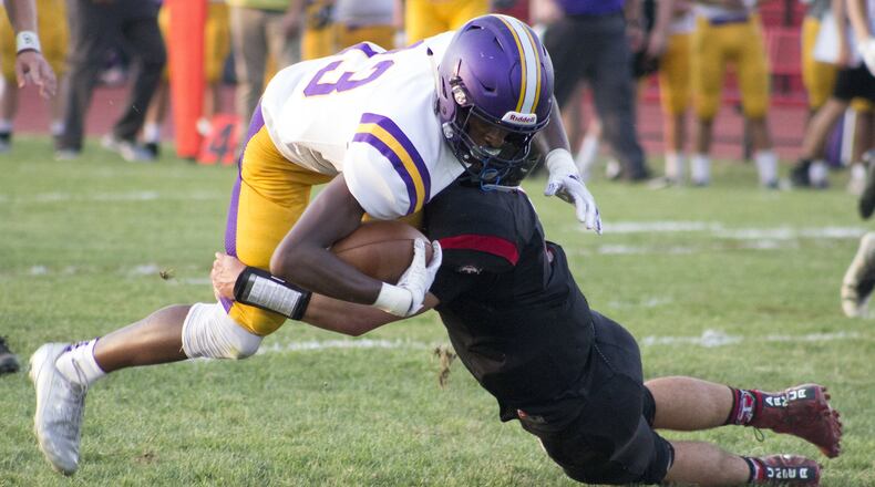Vandalia-Butler receiver Bryant Johnson is tackled by a Tecumseh defender after one of his eight receptions on Friday, Aug. 31, 2018. He gained 99 yards and scored two touchdowns to help the Aviators to a 49-28 victory. Jeff Gilbert/CONTRIBUTED