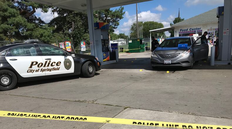 Springfield police officers investigate a shooting at the Sunoco Gas Station on the corner of East Street and Selma Road. JEFF GUERINI/STAFF