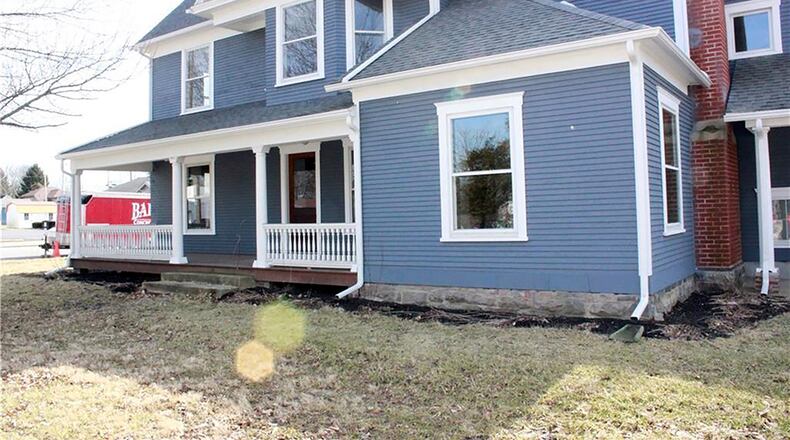 The 4-bedroom, 2-story home offers about 2,605 sq. ft. and features original woodwork and freshly refinished floors. Two doors lead inside from the full, covered front porch. CONTRIBUTED PHOTO
