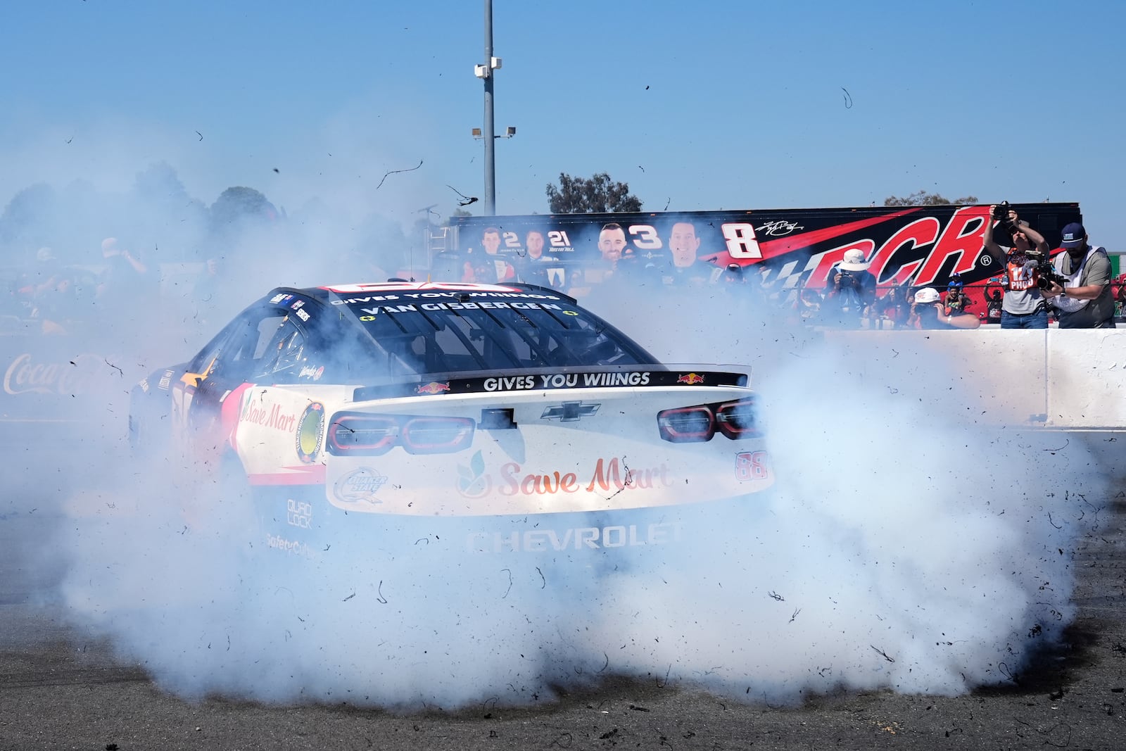 Shane van Gisbergen performs a burnout as he celebrates after winning a NASCAR Cup Series auto race at Sonoma Raceway, Sunday, July 13, 2025, in Sonoma, Calif. (AP Photo/Godofredo A. Vásquez)
