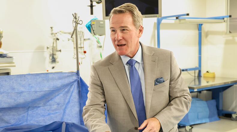 Sen. Jon Husted talks after stitching a mannequin's chest during a visit to Sinclair Community College on Wednesday, Aug. 13 at Ned J. Sifferlen Health Sciences Center. Husted promoted a recent change allowing Pell Grants to be used for workforce credentials. BRYANT BILLING / STAFF