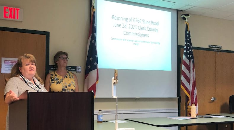 Kathleen Baber, left, and Kathy Voytko led a meeting of more than 60 Mad River Township residents in Enon Wednesday to discuss concerns for a recently approved rezoning for a proposed subdivision. Photo by Brett Turner