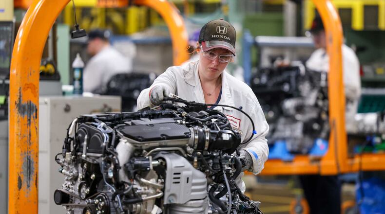 An associate works on an engine on the assembly line at Honda's Anna Engine Plant on Tuesday, July 15. The plant is celebrating its 40th anniversary. BRYANT BILLING / STAFF