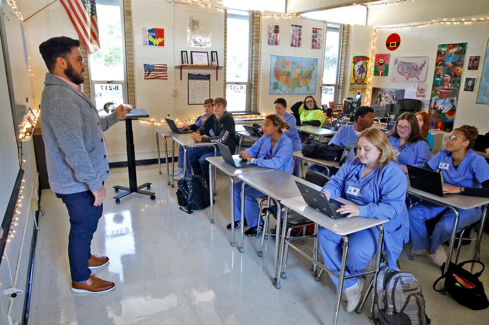 Ross Lunsford teaches his government class in a crowded classroom at the Springfield-Clark Career Technology Center.  BILL LACKEY/STAFF