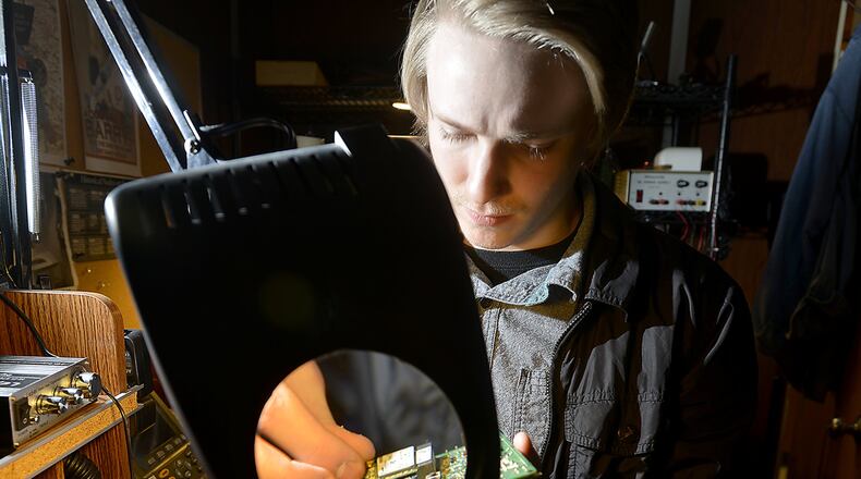 Cody Wicks works on a project in the IT department at Ohio Stamping in Springfield on Friday. Wicks was a former student in the Springfield High School internship program and now works for the company he interned for. Bill Lackey/Staff