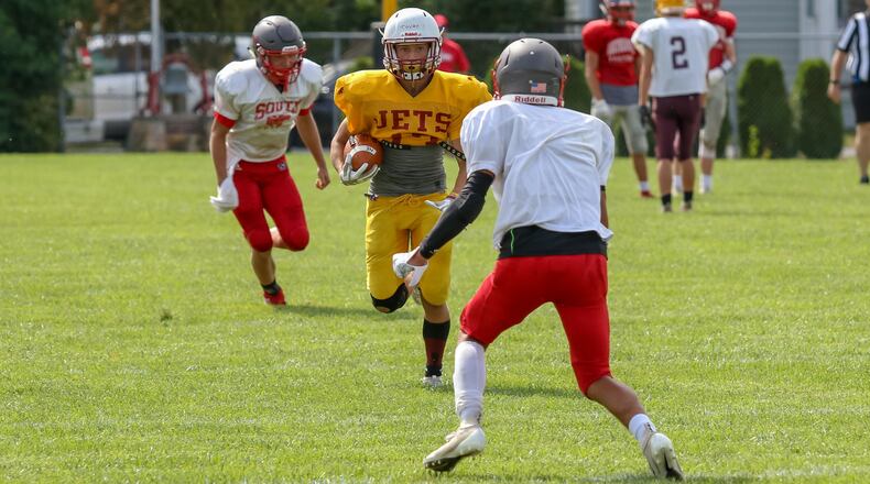 Northeastern High School junior Joseph Kovac runs the ball against Twin Valley South during a five-team scrimmage on Saturday morning at Southeastern. CONTRIBUTED PHOTO BY MICHAEL COOPER