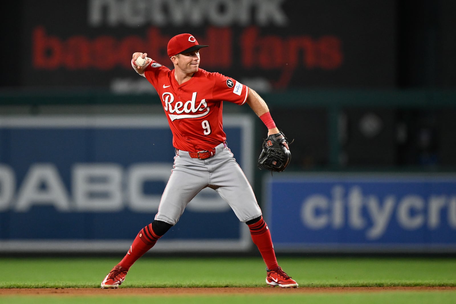 Cincinnati Reds second baseman Matt McLain throws to first base for an out on a ball hit by Washington Nationals' James Wood off Reds pitcher Taylor Rogers during the seventh inning of a baseball game in Washington, Monday, July 21, 2025. (AP Photo/Terrance Williams)