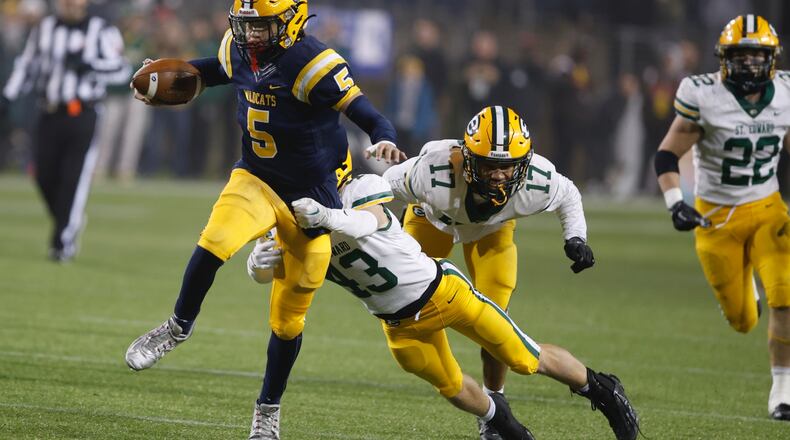 Springfield's Aaron Scott runs for a first down against Lakewood St. Edward during the Division I state championship game in Canton on Friday, Dec. 1, 2023. BILL LACKEY/STAFF