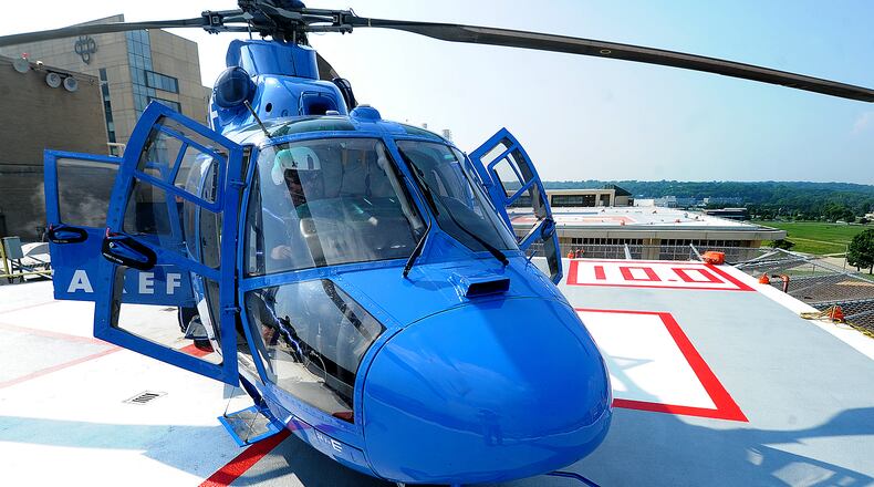A CareFlight pilot prepares for takeoff off the south pad atop Miami Valley Hospital on Wednesday, July 5, 2023. MARSHALL GORBY\STAFF