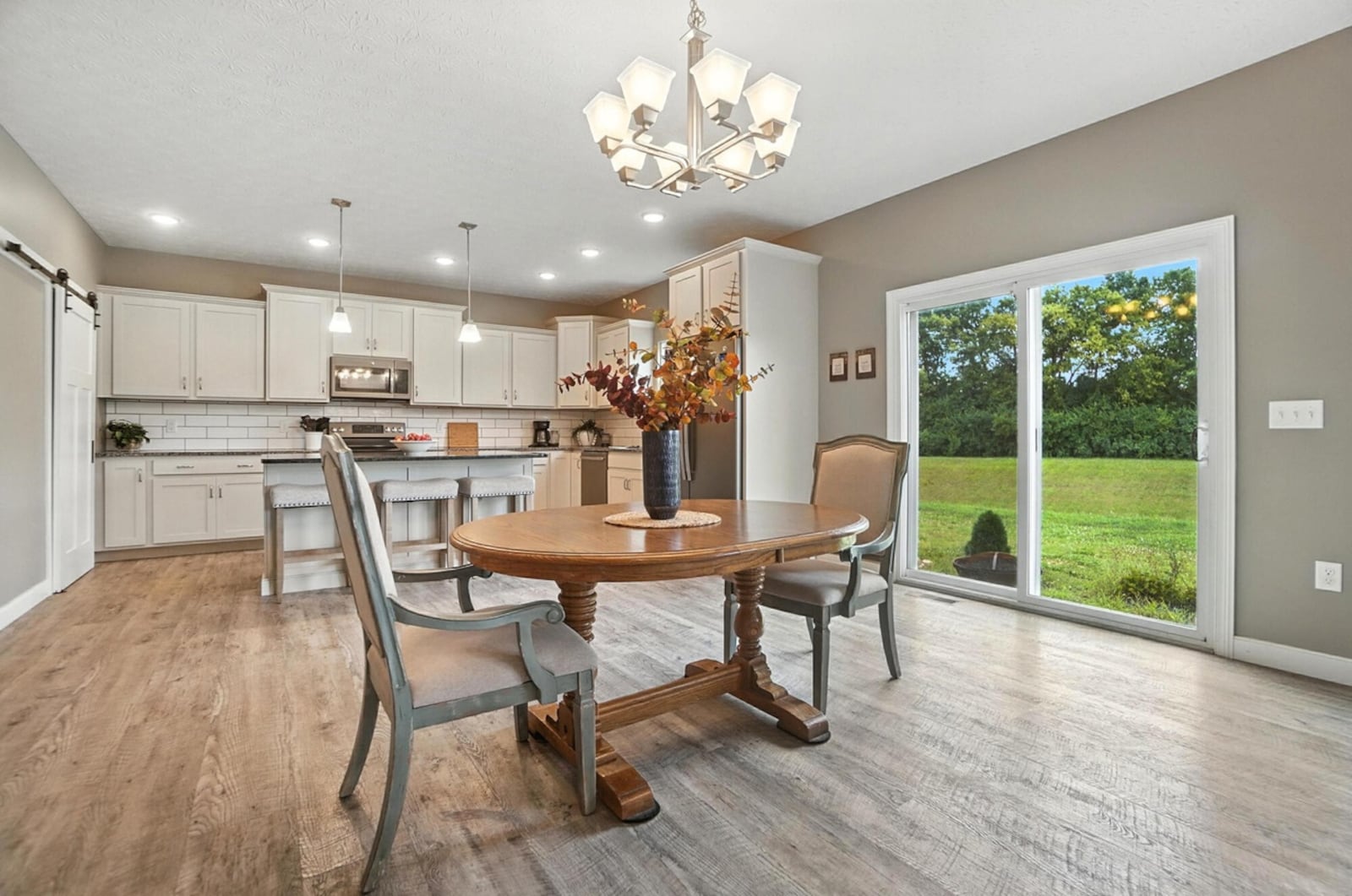 The eating in kitchen has LVT flooring, white cabinets with stainless appliances and an oversized walk in pantry. CONTRIBUTED