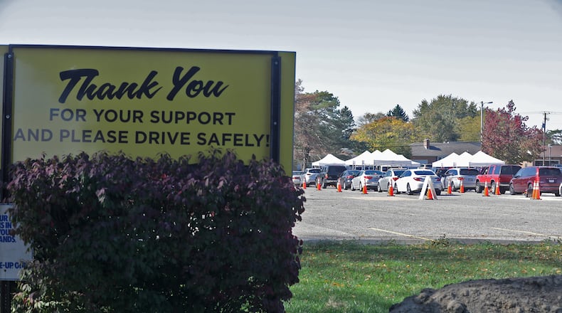 The Clark County Combined Health District held a free drive-thru COVID-19 testing clinic in the parking lot of Kenton Ridge High School on Oct. 16 after an outbreak in the district. The district will continue with the hybrid learning model for two weeks due to Clark County’s increased coronavirus data. BILL LACKEY/STAFF