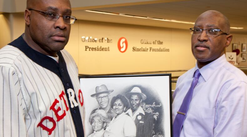 Sinclair professor and former Trotwood coach Michael Carter, right, and his brother Darnell Carter are giving an open-to-public presentation for Black History Month on five coaches who integrated sports in 1966. This drawing is a composite of their parents wedding day and as older adults. The men attribute their successes to strong family ties and values. TY GREENLEES / STAFF