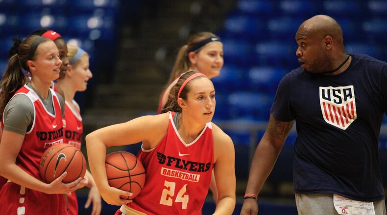 Dayton’s Laura Cannatelli, center, practices at UD Arena on Tuesday, Oct. 11, 2016. David Jablonski/Staff