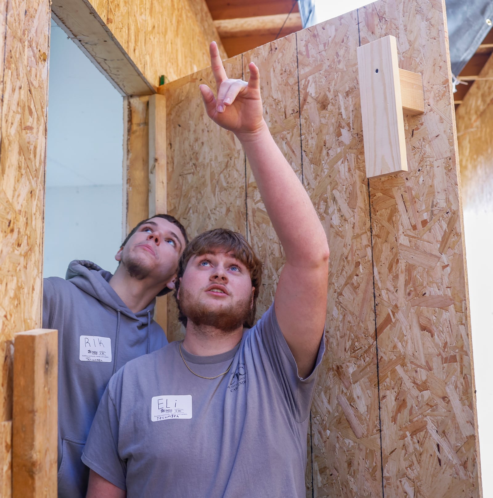 Erik Ferrell, left, and Eli Koster, students at Springfield-Clark Career Technology Career, lead a tour on Thursday, Feb. 26, 2026 of a modular home built at Springfield-Clark CTC as part of a partnership with the Habitat for Humanity of Greater Dayton and Springfield-Clark CTC. JOSEPH COOKE/STAFF