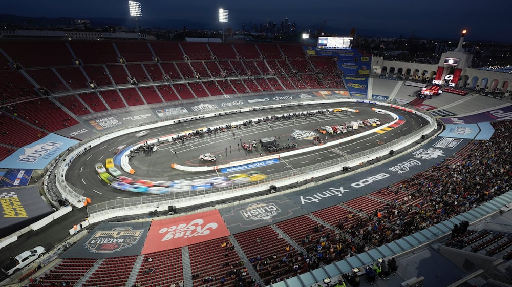 FILE - Cars race during the Busch Light Clash NASCAR exhibition auto race at Los Angeles Memorial Coliseum, Feb. 3, 2024, in Los Angeles. (AP Photo/Mark J. Terrill, File)
